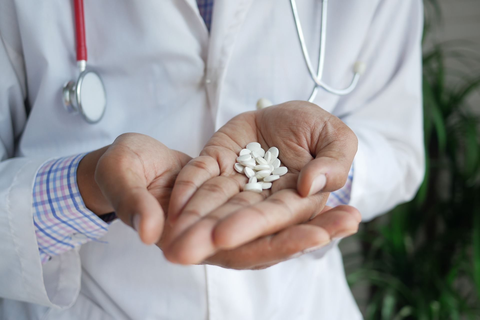 man with pills in his hand