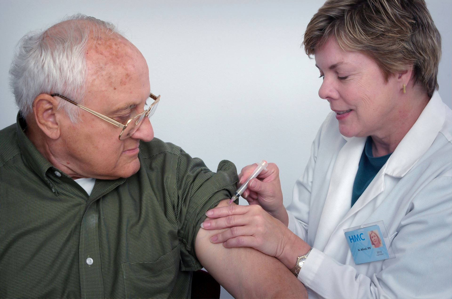an older man being vaccinated